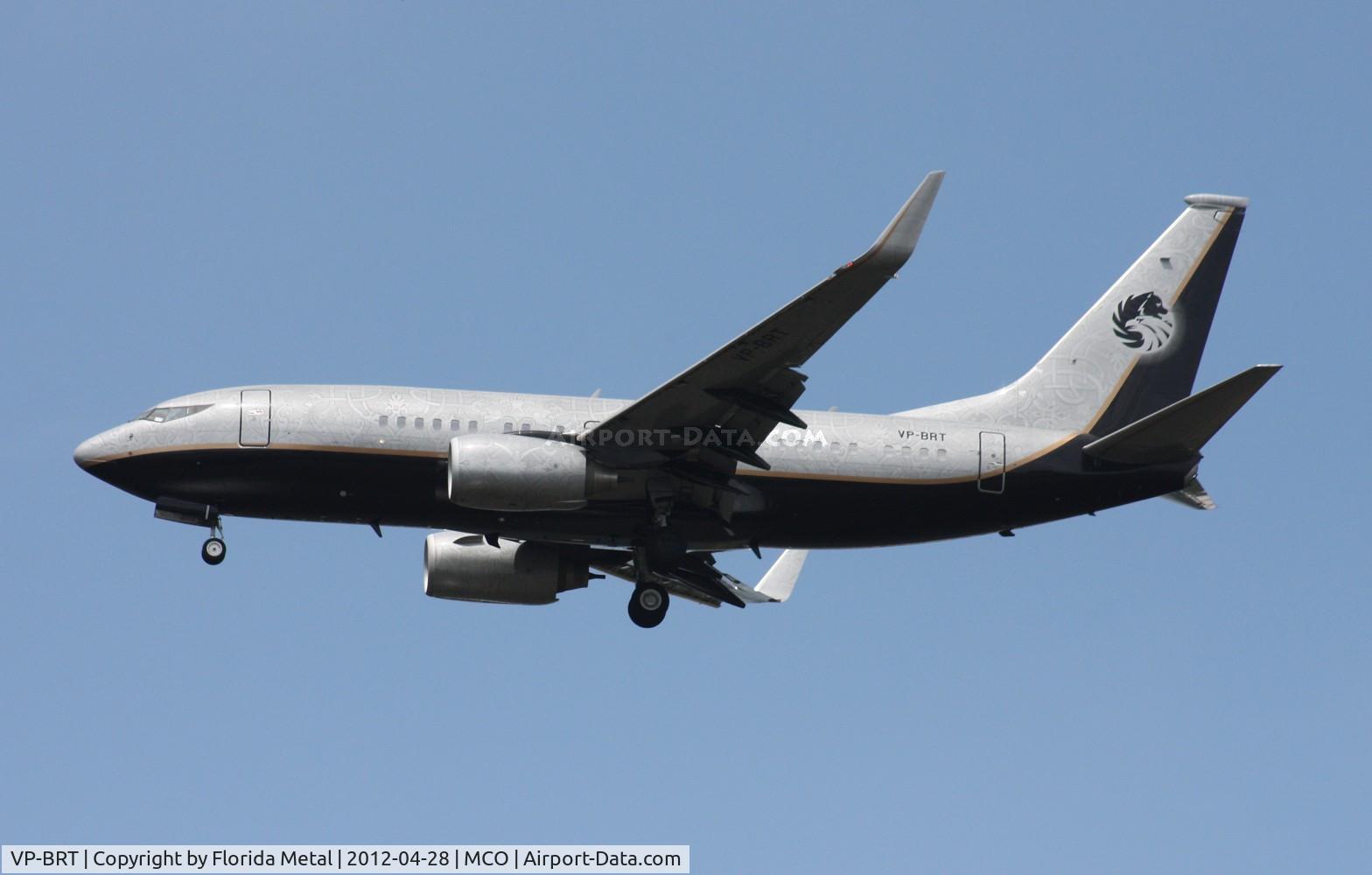 VP-BRT, 2001 Boeing 737-7BC C/N 32970, Very interesting paint job in this BBJ - all kinds of detailed designs in the silver portion of the paint