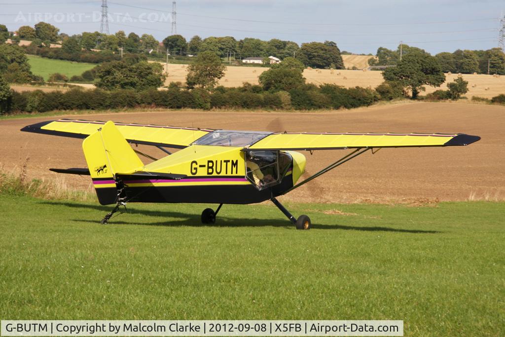 G-BUTM, 1993 Rans S-6-116 Coyote II C/N PFA 204A-12414, Rans S6-116 makes it's way down the taxiway to take off from 26 at Fishburn Airfield UK, September 2012.
