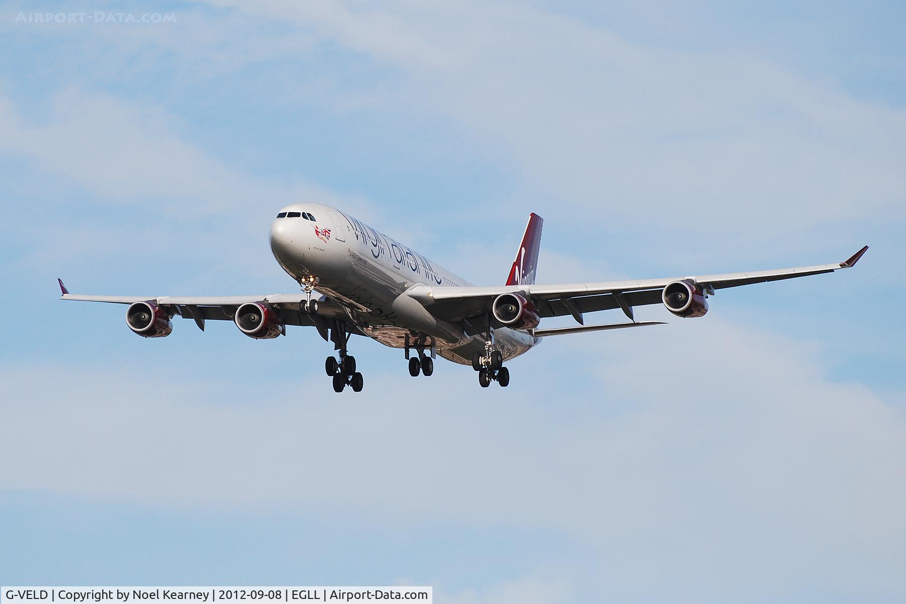 G-VELD, 1998 Airbus A340-313X C/N 214, Seen landing Rwy 27R at Heathrow Apt.