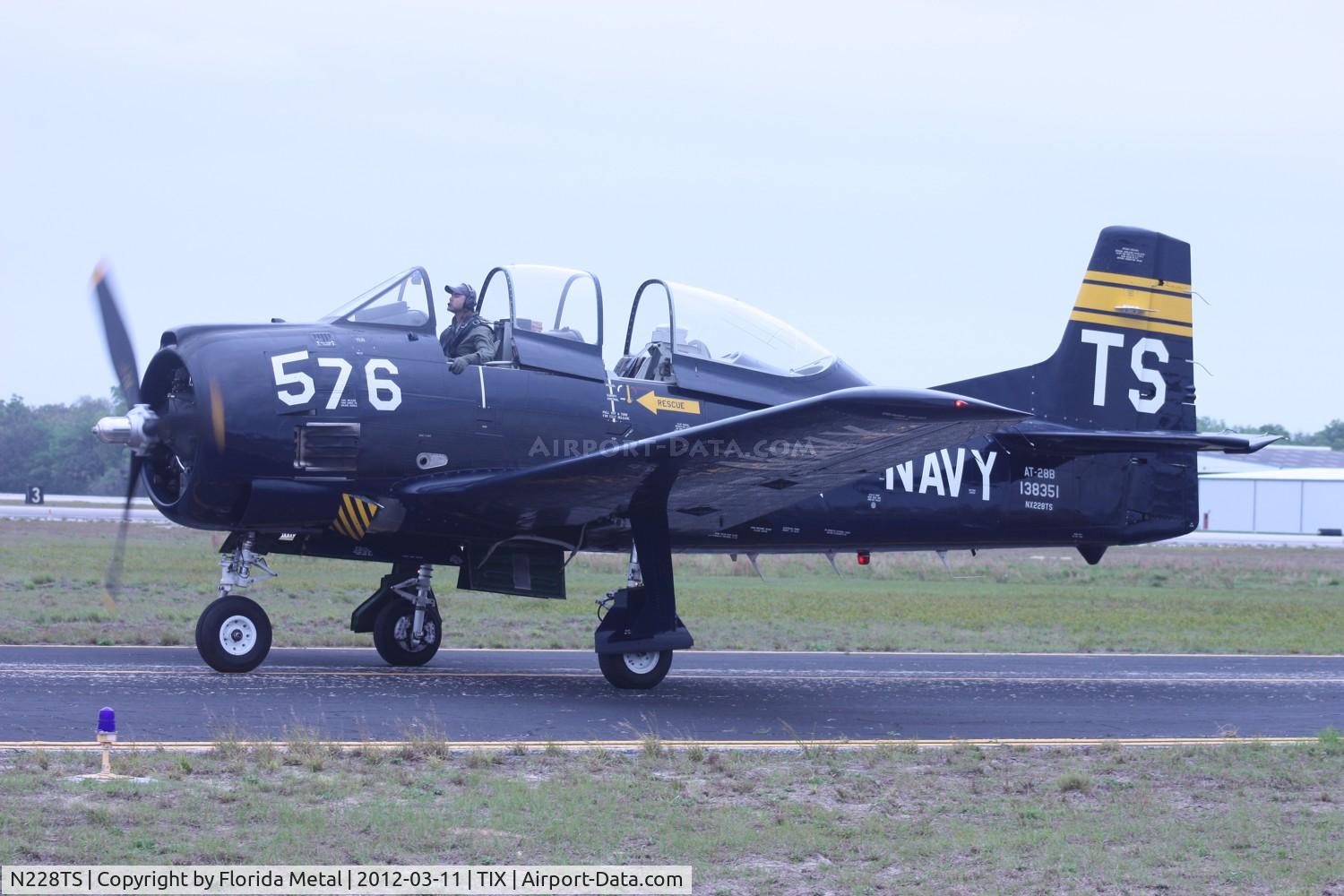 N228TS, 1954 North American T-28D Trojan C/N 200-422, T-28 Trojan.  With the dark conditions of low overcast skies, I changed my camera settings a little and it gave it an old school film look.