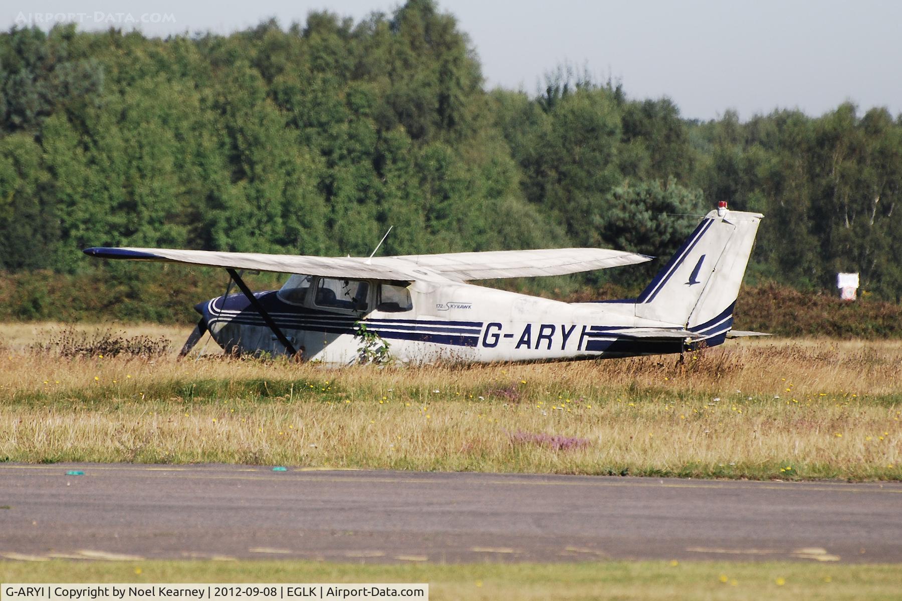 G-ARYI, 1962 Cessna 172C C/N 17249260, Parked in a neglected state on the grass at Blackbushe.