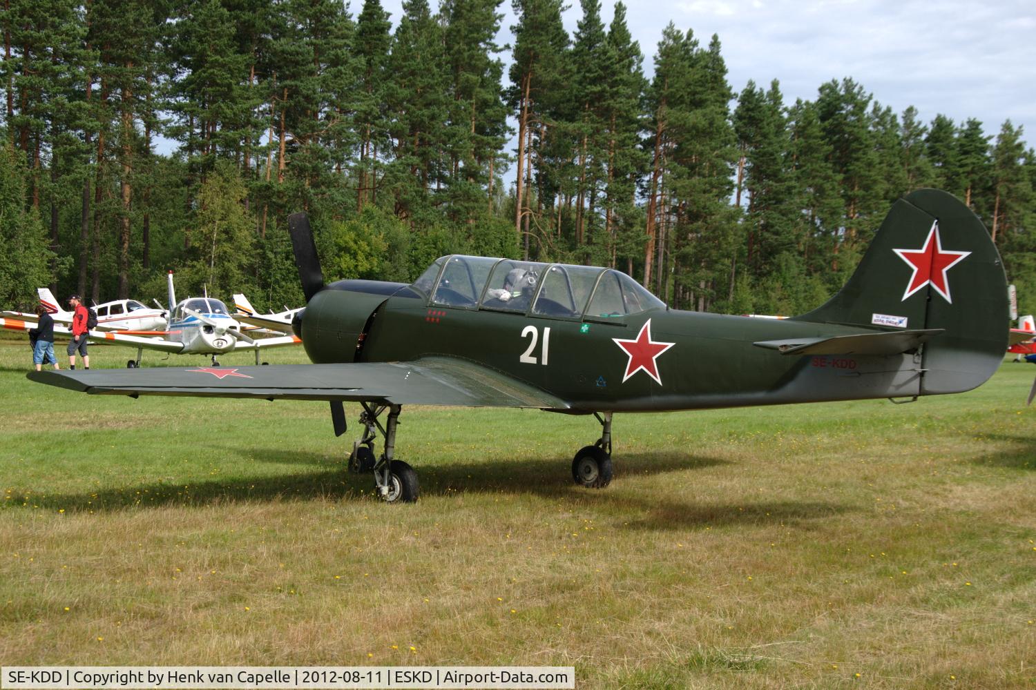 SE-KDD, 1980 Yakovlev Yak-52 C/N 801003, Yak-52 with red stars parked at Dala-Järna airfield, Sweden.