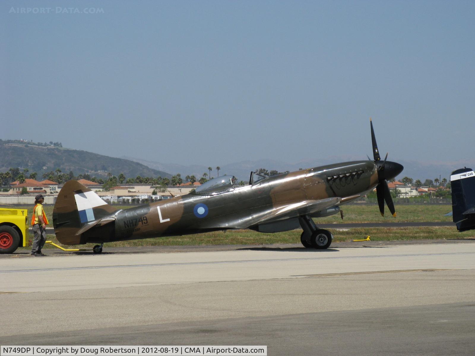 N749DP, 1945 Supermarine Spitfire XIV C/N 6S/583887, 1983 Vickers/Supermarine SPITFIRE Mk.XIVe, Rolls Royce GRIFFON 65 V-12 2,050 Hp, 5-blade prop, spotting on flight line