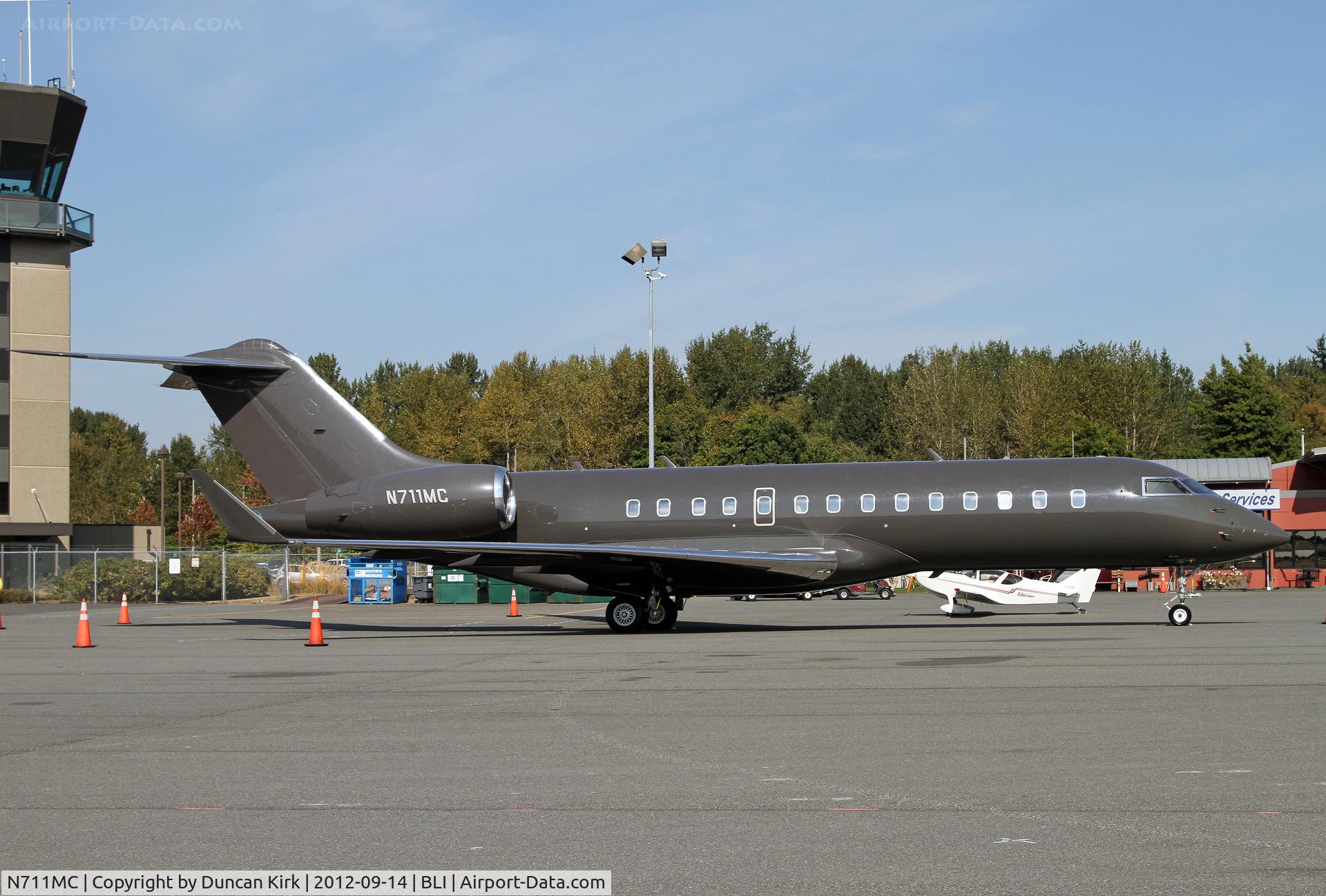 N711MC, 2002 Bombardier BD-700-1A10 Global Express C/N 9121, Drab but pleasing colors on this Global Express