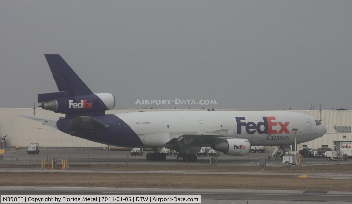 N358FE, 1979 McDonnell Douglas MD-10-10F C/N 46633, Fed Ex MD-10-10F taken from the window of a US Airways A319 as we are pulling in to the North Terminal at DTW - wish I had a cleaner window on the plane.