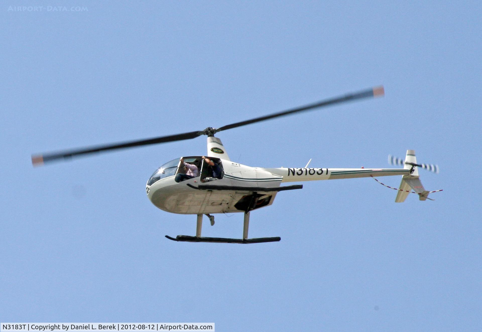 N3183T, 2007 Robinson R44 II C/N 11550, A tour helicopter takes journalists or curiosity seekers over El Morro Castle in Old San Juan, where a peace demonstration was under way.