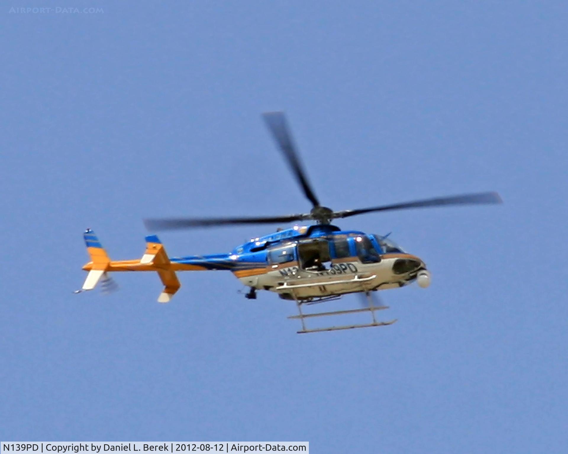 N139PD, 2004 Bell 407 C/N 53631, A Puerto Rico Police Department helicopter keeps an eye on a peace demonstration taking place at Castillo El Morro, Old San Juan, PR.