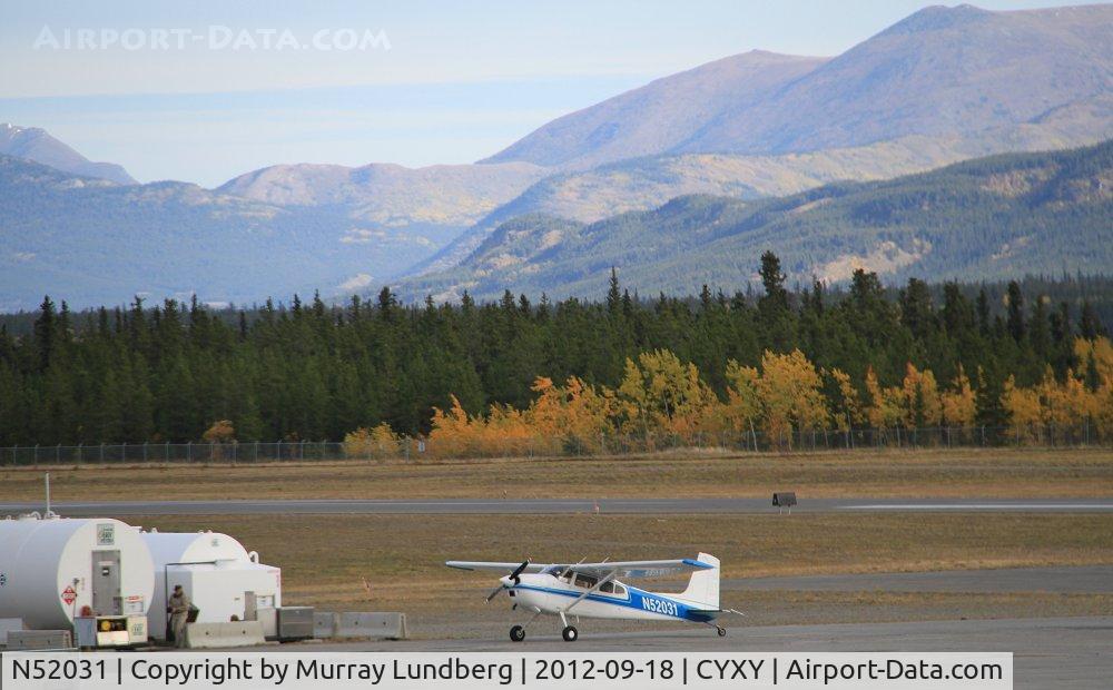 N52031, 1974 Cessna 180J C/N 18052451, Fueling up at Whitehorse, Yukon.
