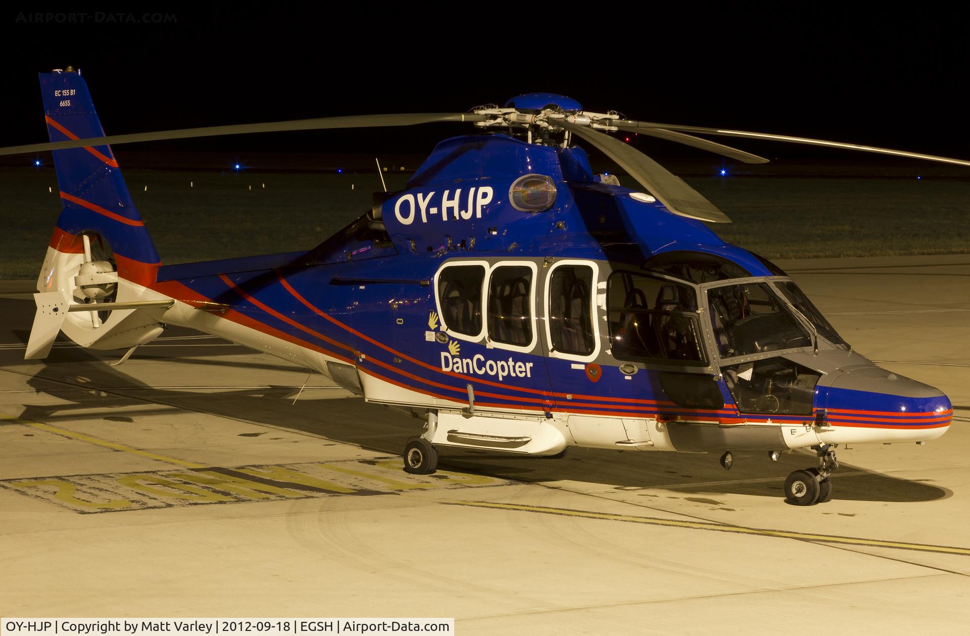 OY-HJP, 2003 Eurocopter EC-155B-1 C/N 6655, Sat under the floodlights at SaxonAir.