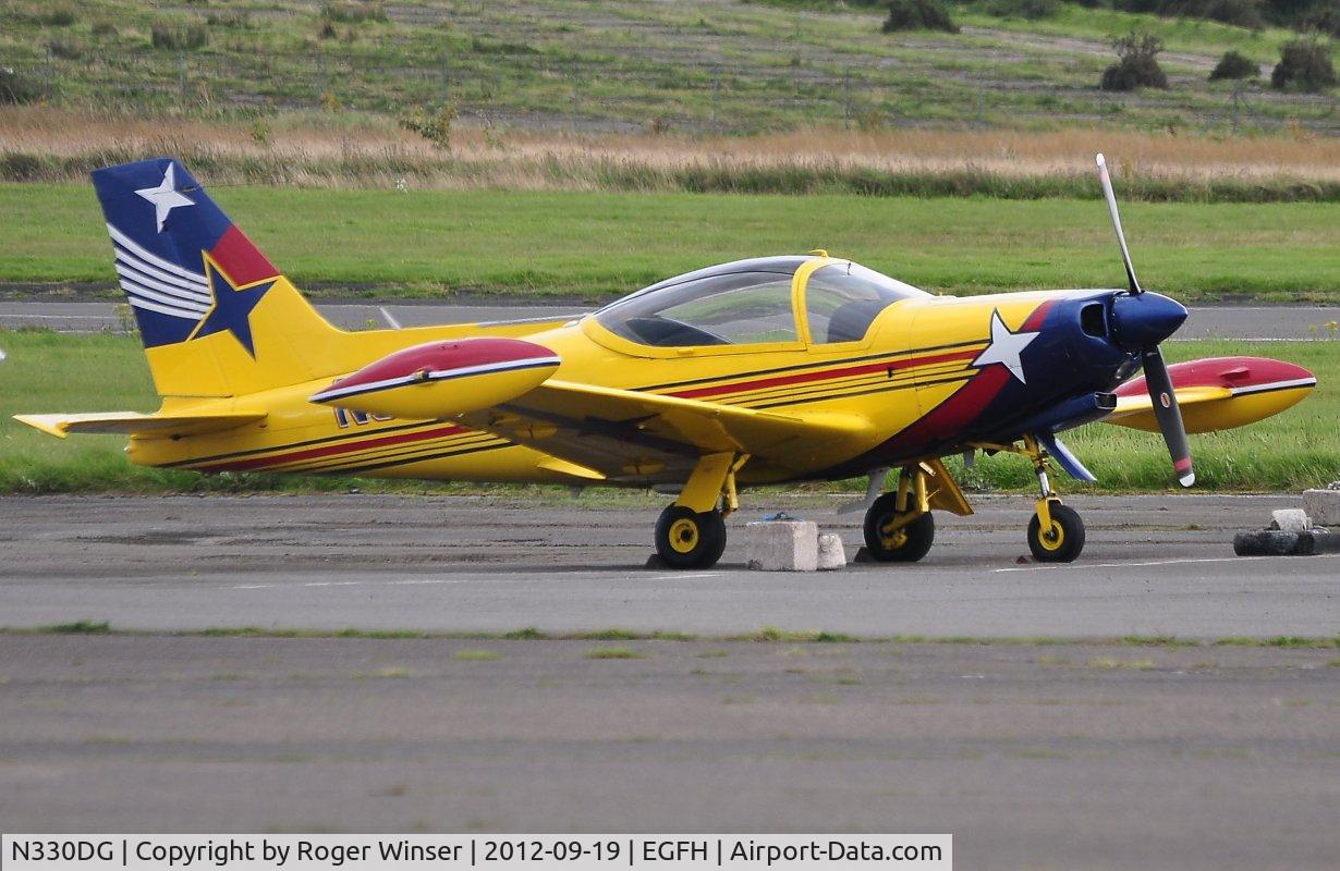 N330DG, 1991 SIAI-Marchetti SF-260D C/N 766, Colourful SF-260D visiting Swansea Airport.