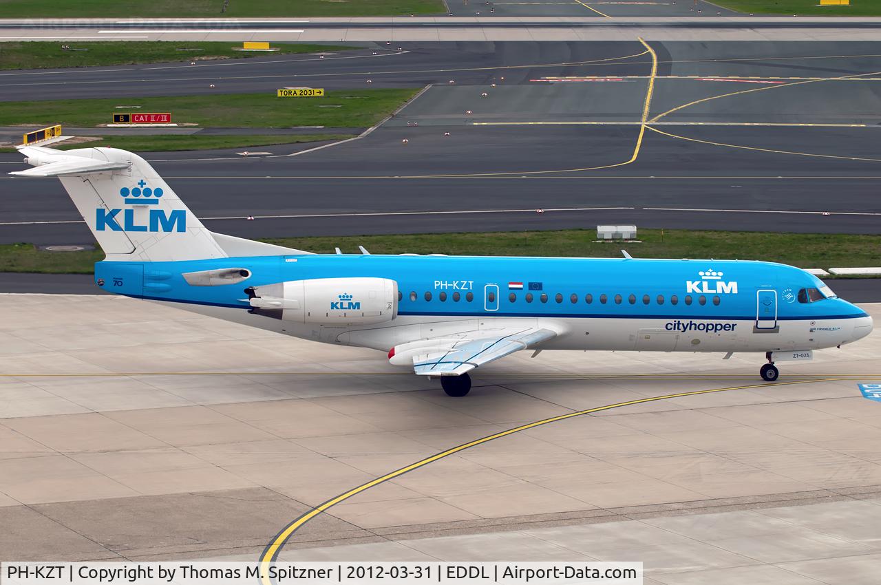 PH-KZT, 1995 Fokker 70 (F-28-0070) C/N 11541, KLM Cityhopper PH-KZT awaiting it's taxi clearance twds. Rwy23L. Ex F-GLIT, prev. operator Regional CAE and Air Littoral