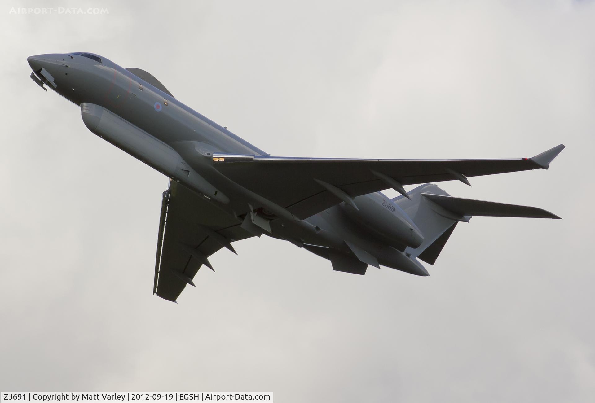 ZJ691, 2002 Bombardier BD-700-1A10 Sentinel R1 C/N 9123, Climbing out of EGSH after spray by Air Livery.