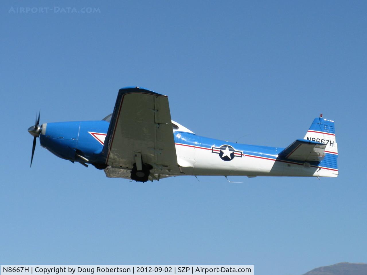 N8667H, 1947 North American Navion C/N NAV-4-667, 1947 North American NAVION, Continental IO-520 285 Hp upgrade, takeoff climb Rwy 22 with Young Eagles aboard. Main gear not quite fully up.