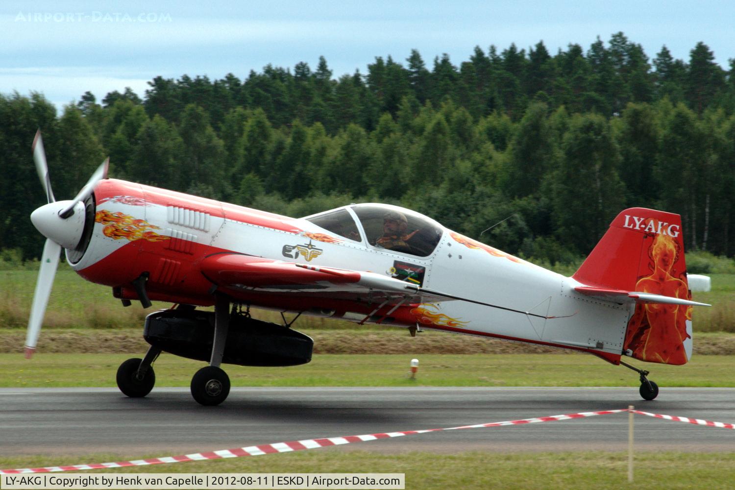 LY-AKG, Sukhoi SU-26M C/N 06-03, Jurgis Kairys arriving at Dala-Järna airfield with external tank and newly painted rudder.