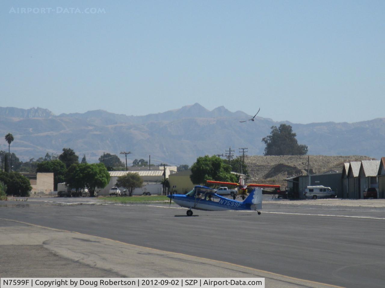 N7599F, 1970 Champion 7ECA Citabria C/N 745-70, 1970 Champion 7ECA CITABRIA, Lycoming O-235 115 Hp, taxi off the active with Young Eagle rider.
