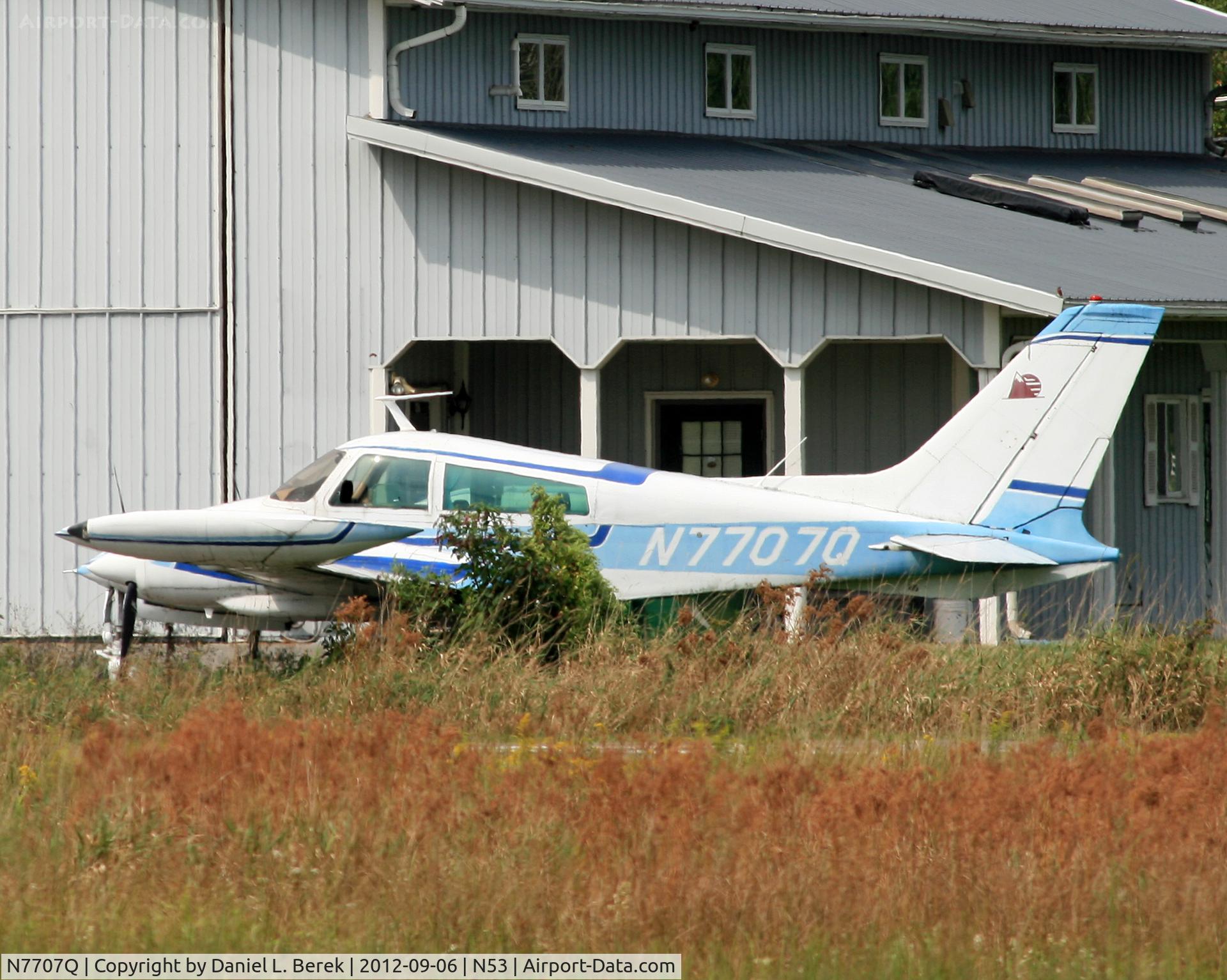 N7707Q, 1970 Cessna 310Q C/N 310Q0207, Found this sleek Cessna 310 way over on the other side of the field.