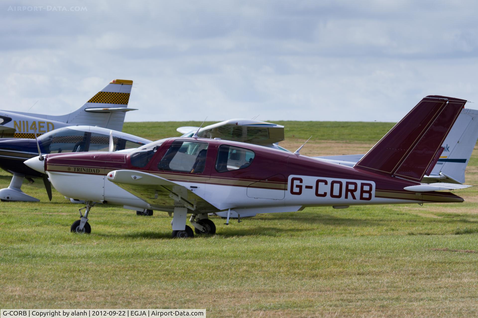 G-CORB, 1990 Socata TB-20 Trinidad C/N 1178, Parked with visitors at the Alderney Air Races, 2012