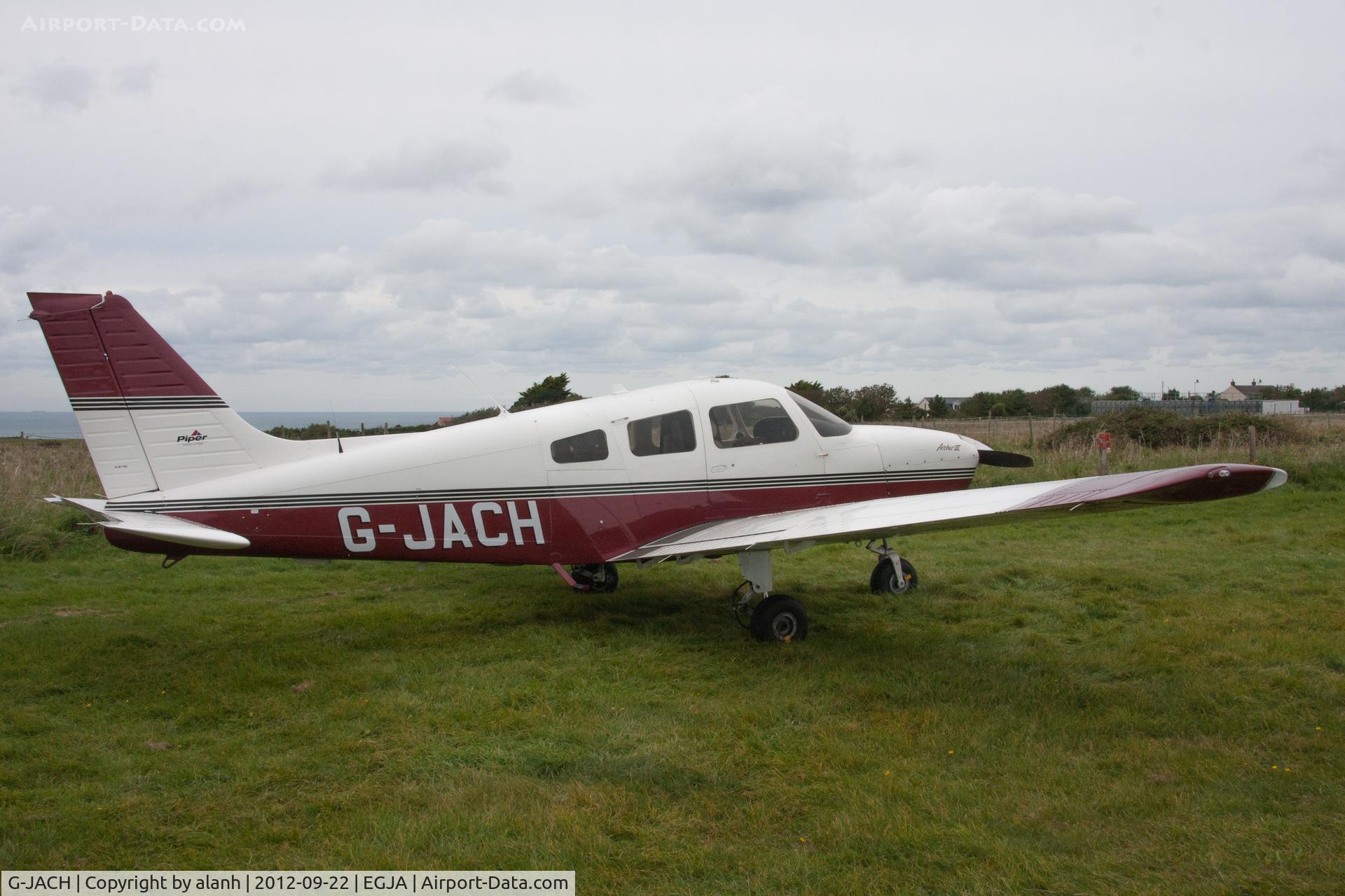 G-JACH, 2003 Piper PA-28-181 Cherokee Archer III C/N 2843585, parked on the grass at the edge of the airfield