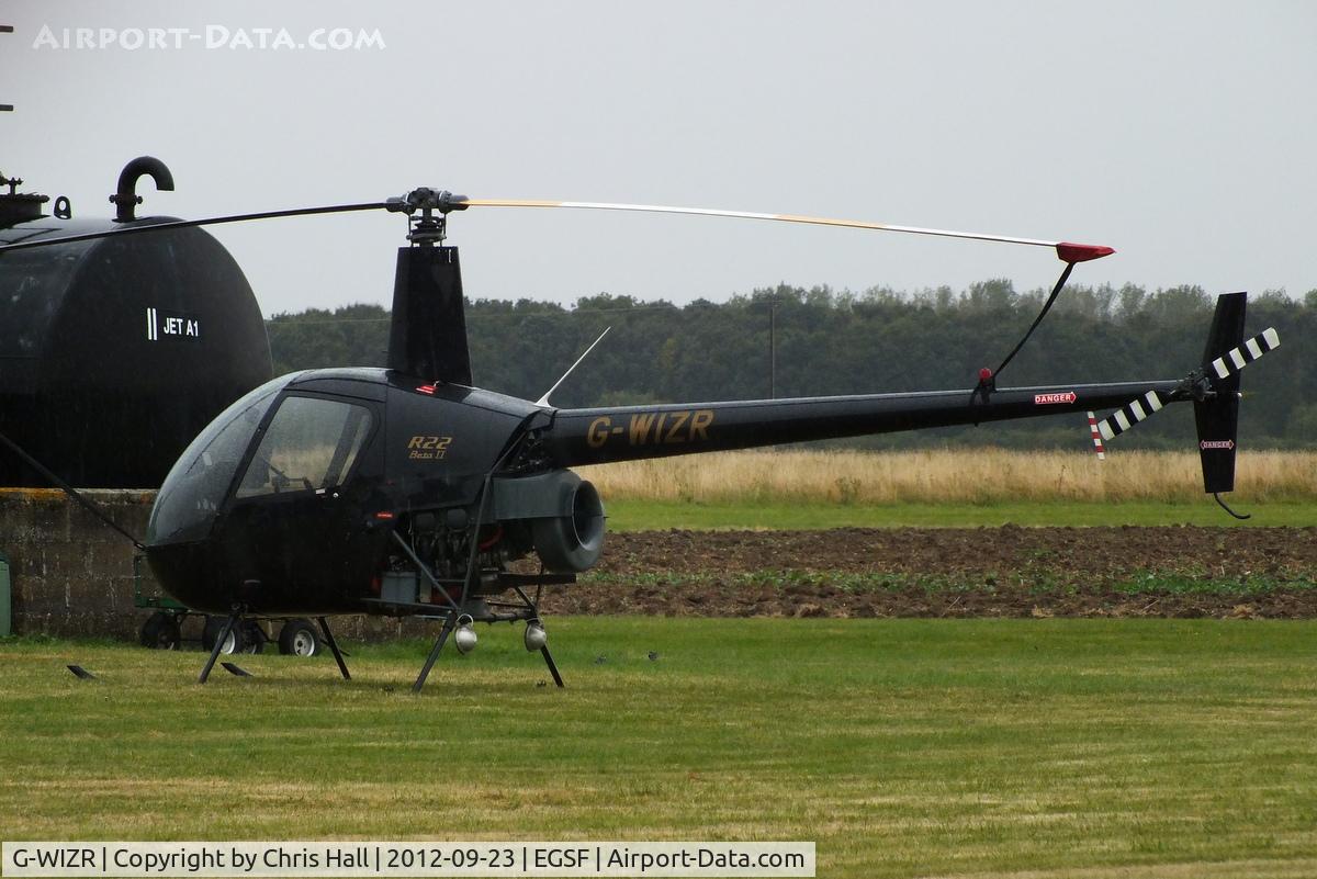 G-WIZR, 1998 Robinson R22 Beta II C/N 2799, at Peterborough Business Airport