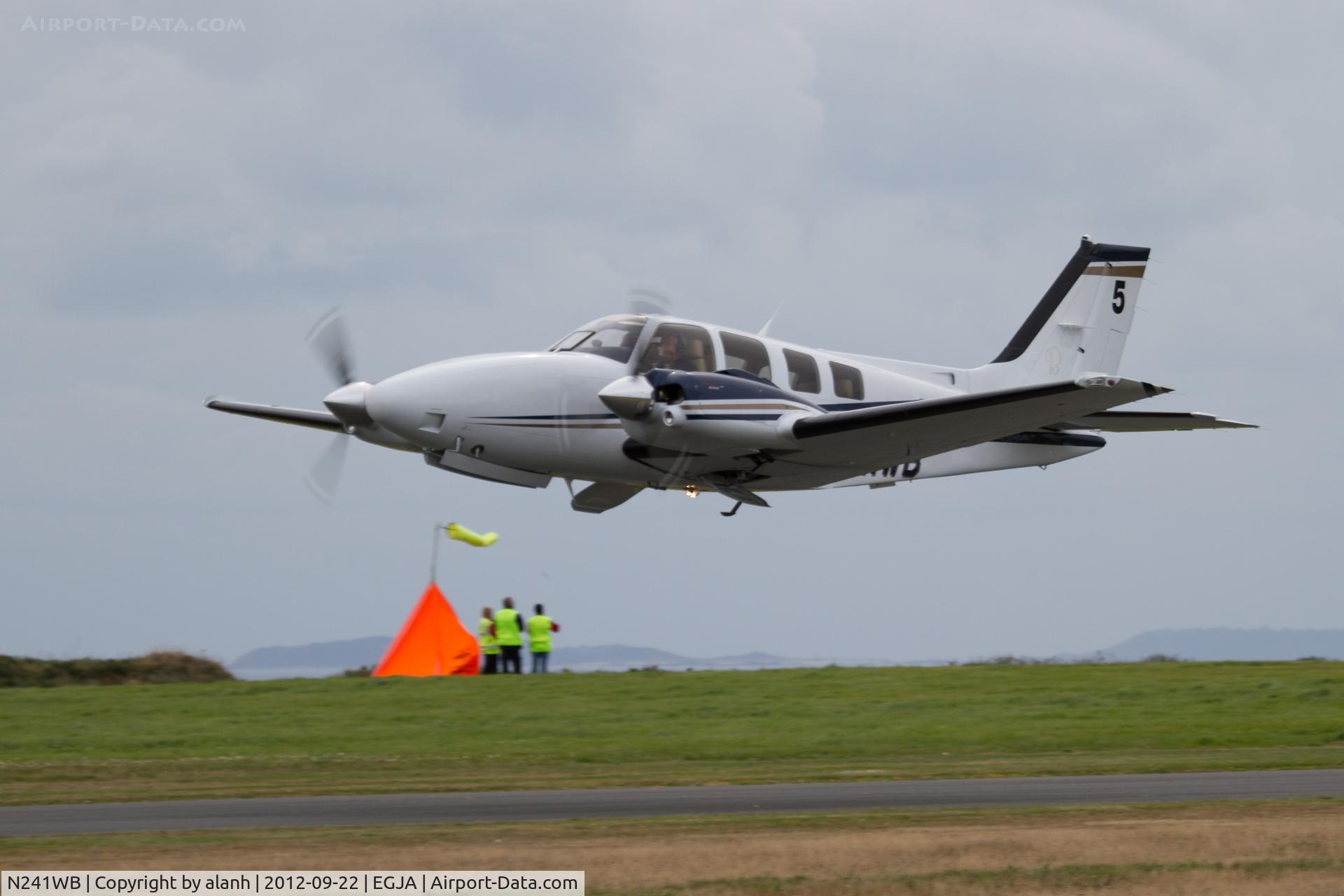 N241WB, Hawker Beechcraft Corp G58 Baron C/N TH-2246, The final competitor gets airborn in the 2012 Schneider Trophy Race, with one of the course markers in the background