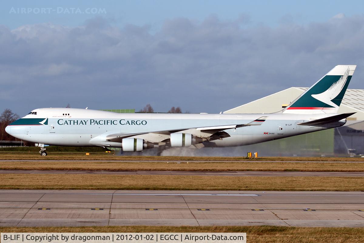 B-LIF, 2009 Boeing 747-467ERF C/N 36871, Kicking up some wet stuff after landing 23R.