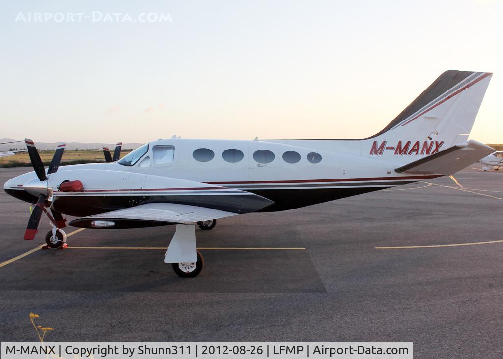 M-MANX, 1981 Cessna 425 Conquest I C/N 425-0044, PArked at the General Aviation area...