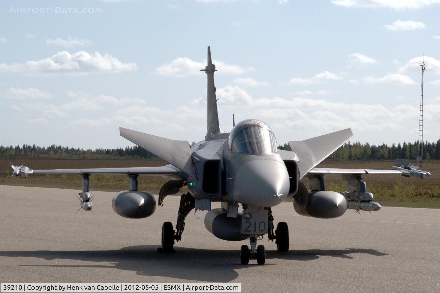 39210, Saab JAS-39C Gripen C/N 39210, Saab Gripen pre-flight checking the canards at Småland Airport, Växjö, Sweden