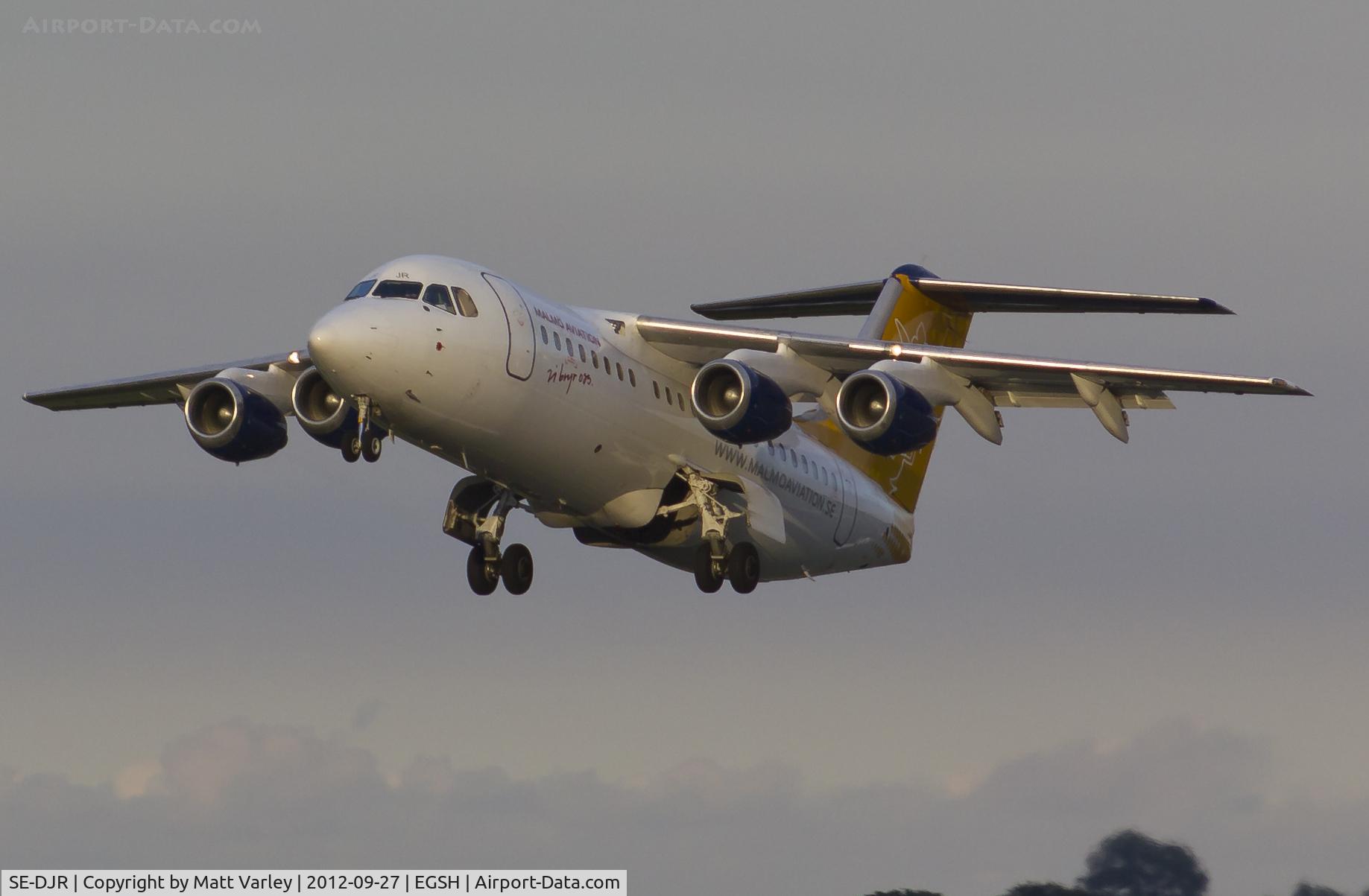 SE-DJR, 2001 BAE Systems Avro 146-RJ85 C/N E.2392, Climbing away in the last light of day.