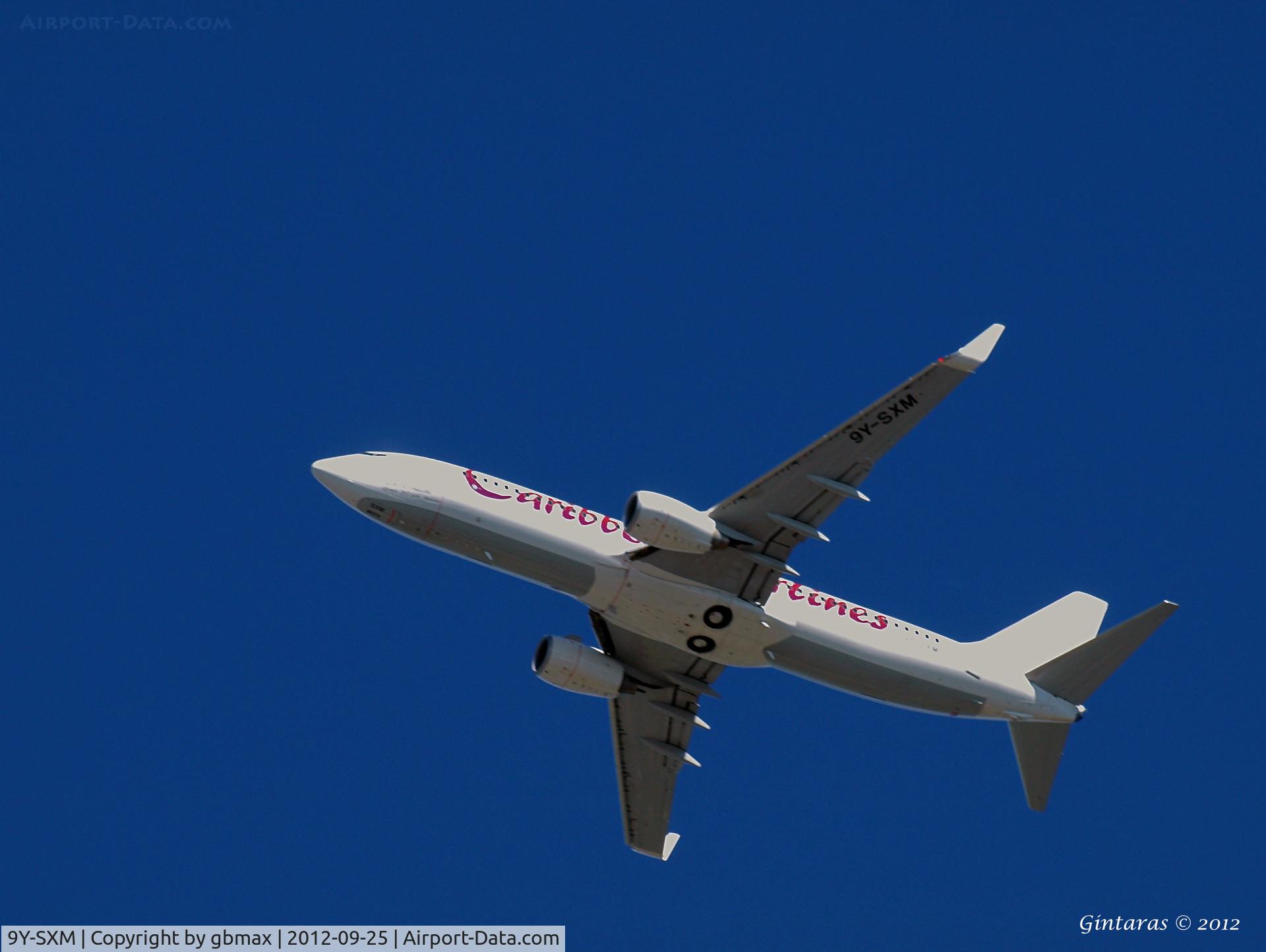 9Y-SXM, 2011 Boeing 737-8HO C/N 37935, On approach to JFK, over Mineola, NY