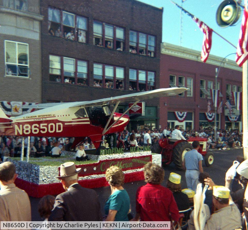 N8650D, 1958 Piper PA-22-160 Tri Pacer C/N 22-5858, Photo was taken in Elkins, WV on a float during the Mountain State Forest Festival.