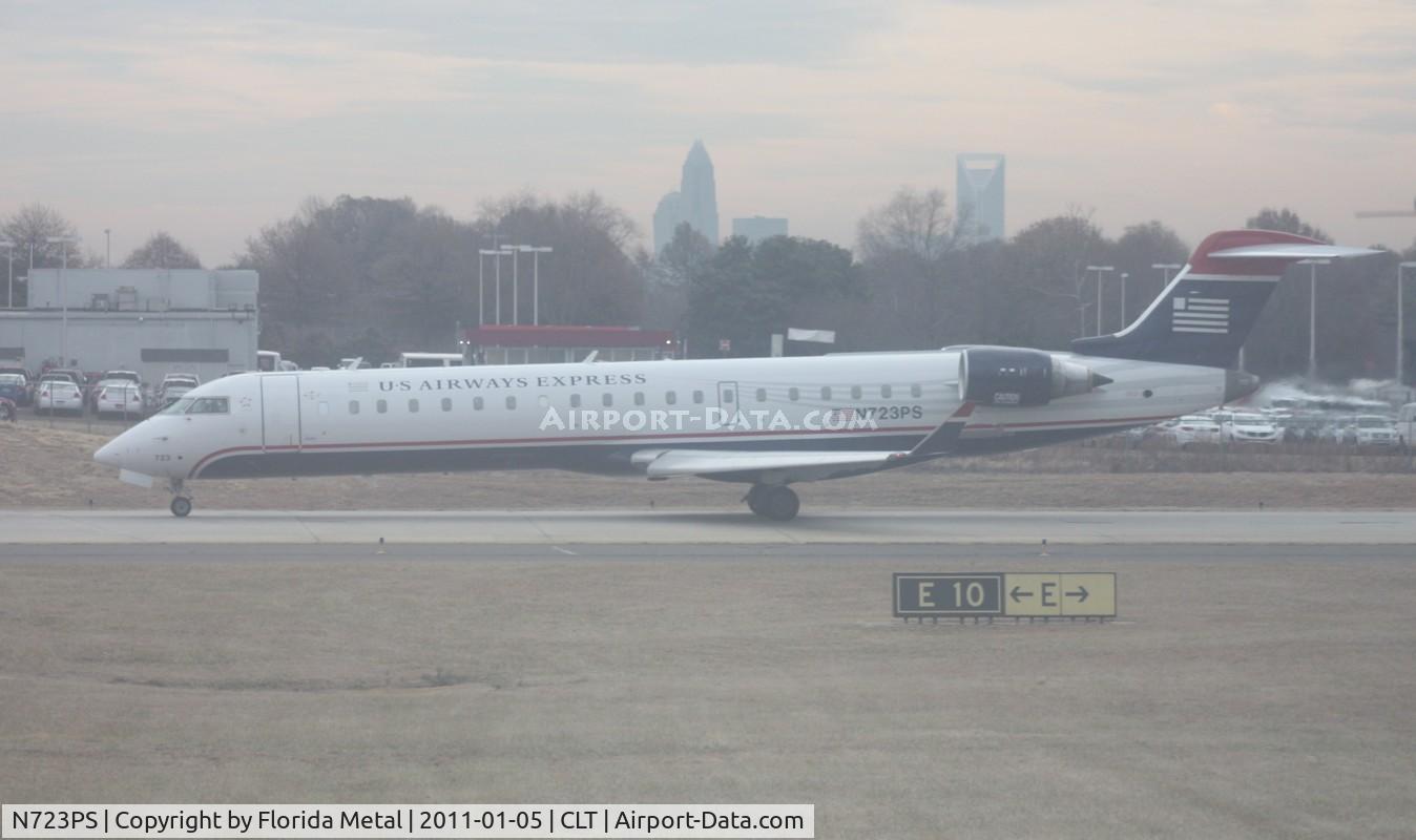 N723PS, 2004 Bombardier CRJ-701 (CL-600-2C10) Regional Jet C/N 10181, US Airways CRJ-700 out dirty window of N744P