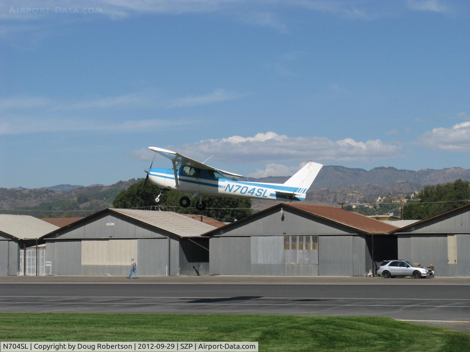 N704SL, 1976 Cessna 150M C/N 15078837, 1976 Cessna 150M, Continental O-200 100 Hp, another takeoff climb Rwy 22