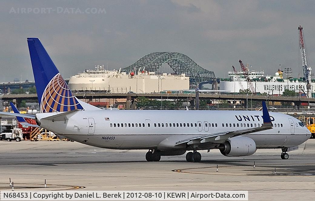 N68453, 2012 Boeing 737-924/ER C/N 41742, Taxying out during a brief sunny break on an otherwise stormy, rainy day at Newark International.