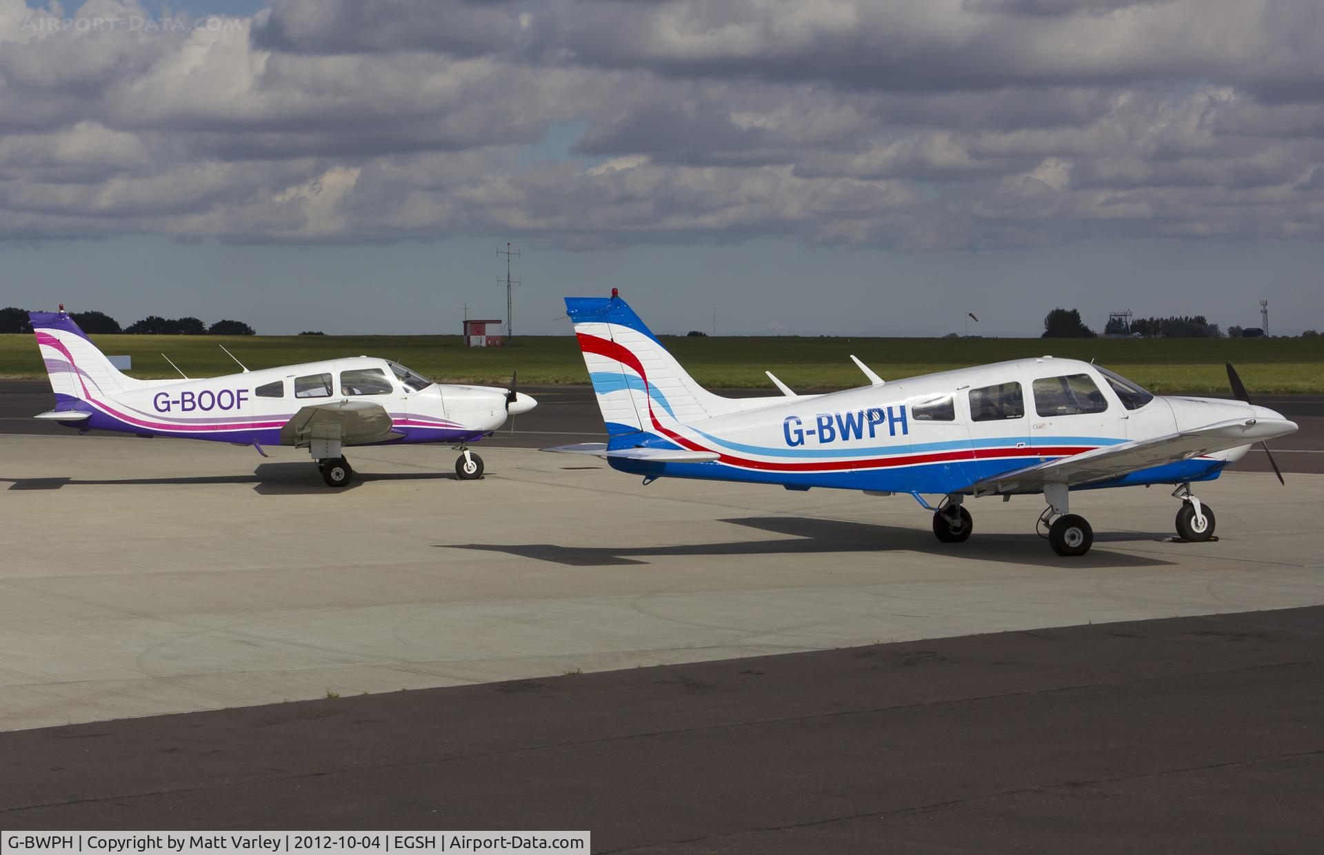 G-BWPH, 1977 Piper PA-28-181 Cherokee Archer II C/N 28-7790311, G-BWPH & G-BOOF sat on stand at SaxonAir.
