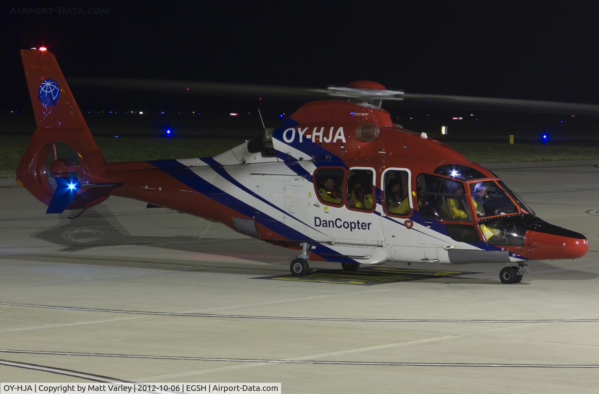 OY-HJA, 2009 Eurocopter EC-155B-1 C/N 6828, Sat under the floodlights at SaxonAir.