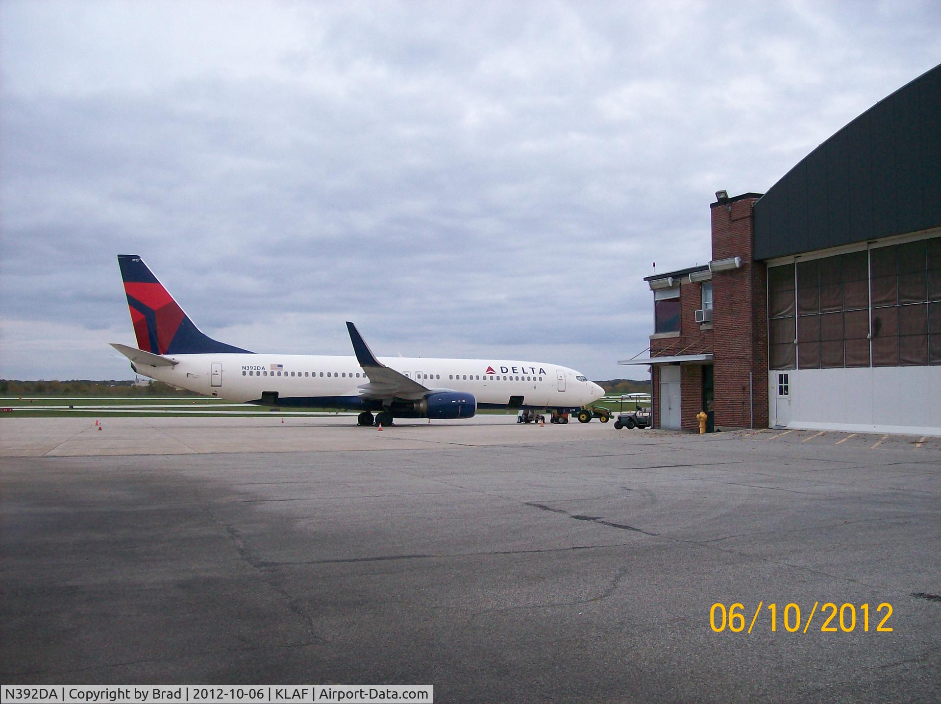 N392DA, 2000 Boeing 737-832 C/N 30561, After http://flightaware.com/live/flight/DAL8914/history/20121006/2140Z/KCVG/KLAF waiting to the the University of Michigan football team home.