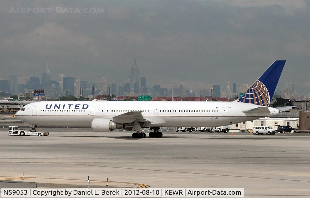 N59053, 2000 Boeing 767-424/ER C/N 29448, A United (ex-Continental) Boeing 767-424 is repositioned across the ramp at Newark Airport.