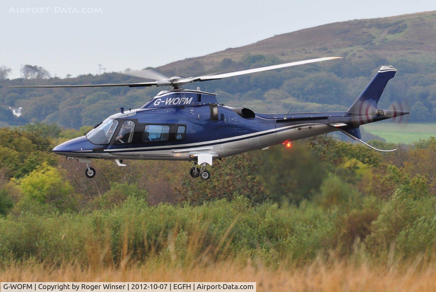 G-WOFM, 2006 Agusta A-109E Power C/N 11678, Visiting helicopter lifting off from Swansea Airport.