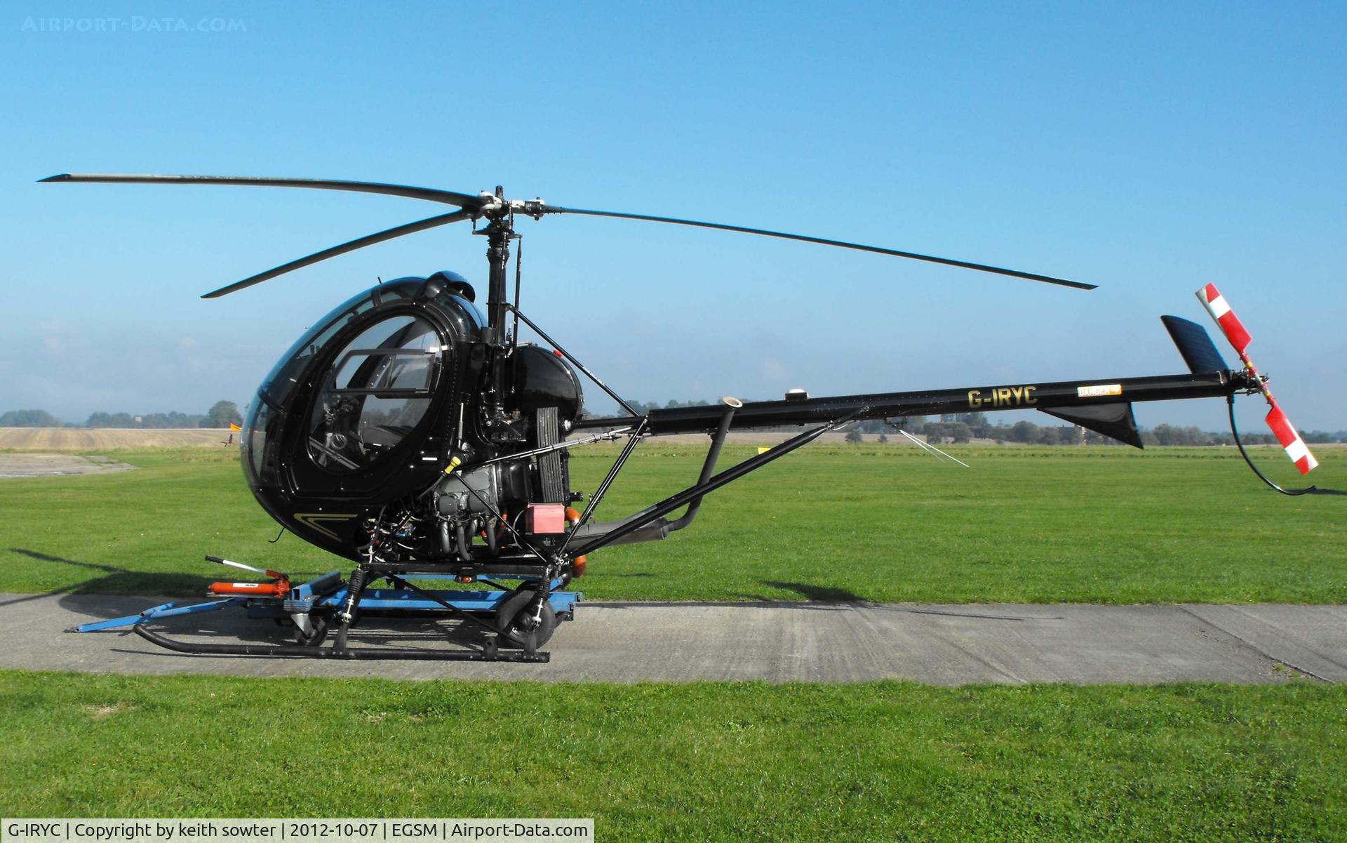 G-IRYC, 2004 Schweizer 269C-1 C/N 0194, Resident - note sitting on trolley for moving around hangar etc