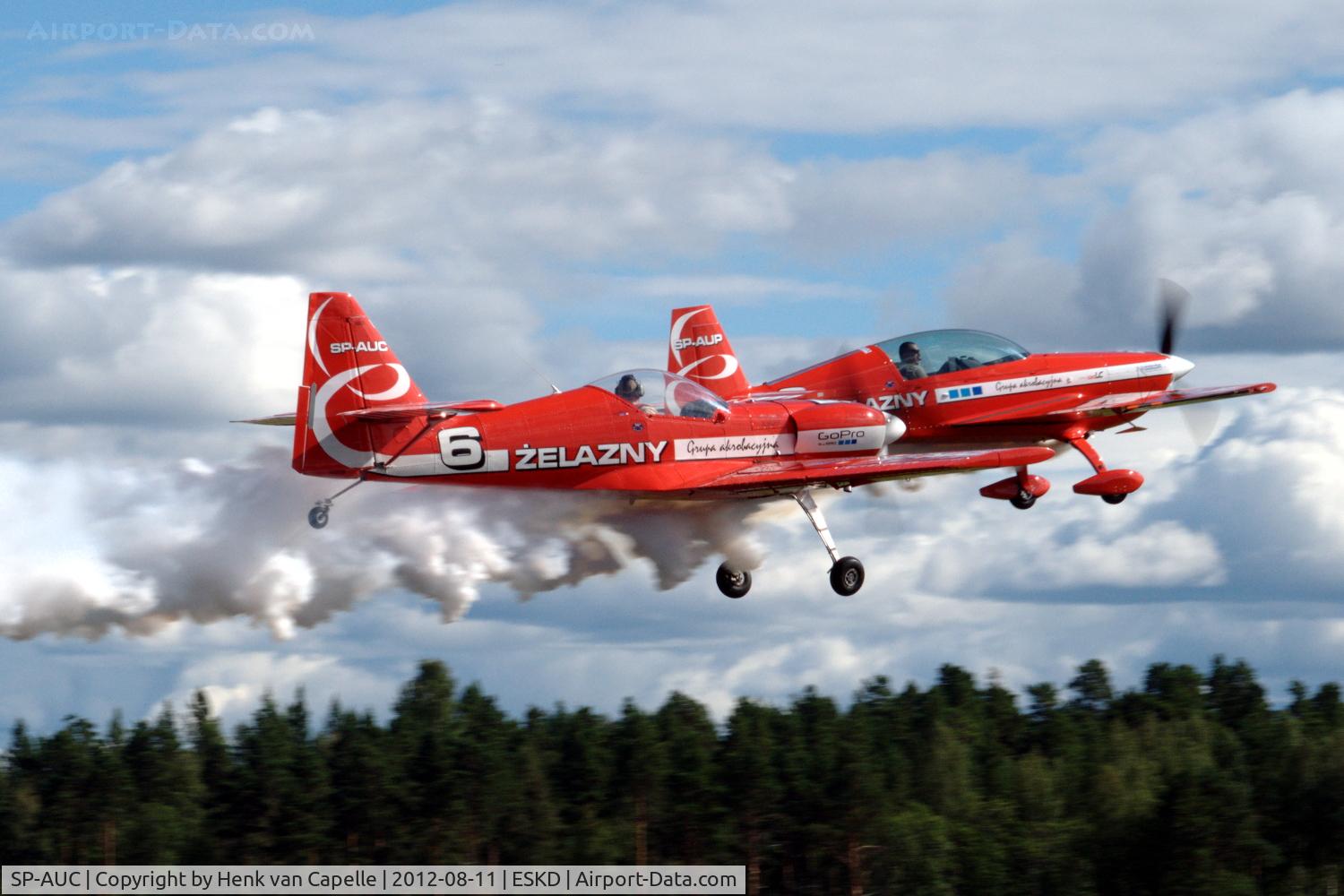 SP-AUC, Zlin Z-50LS C/N 0032, Zlin Z-50LS of the Zelazny Aerobatic Team taking off from Dala-Järna airfield, Sweden. In the background Extra EA-330LC SP-AUP.