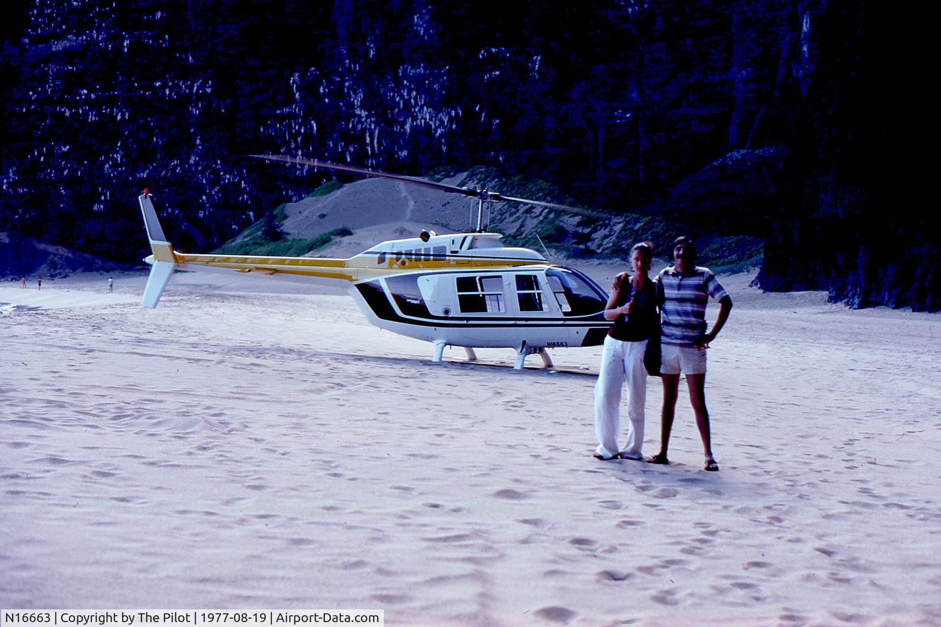 N16663, Bell 206B JetRanger II C/N 2199, The pilot then landed N16663 on a beach on the Na Pali Coast where he took this photo of us in front of the helicopter.  He gave us 5 minutes to visit a waterfall after which we took off to resume the tour.