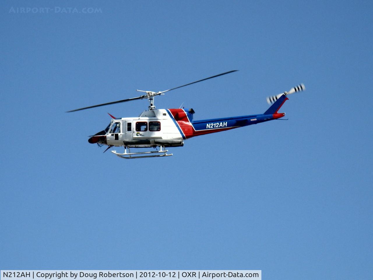 N212AH, 1979 Bell 212 C/N 30959, 1979 Bell 212 TWIN-TWO-TWELVE. P&W(C)PT6T-3 TWIN-PAC coupled free-turbine Turboshaft 1,800 shp, on final for landing adjacent Rwy 25 at Aspen Helicopters ramp