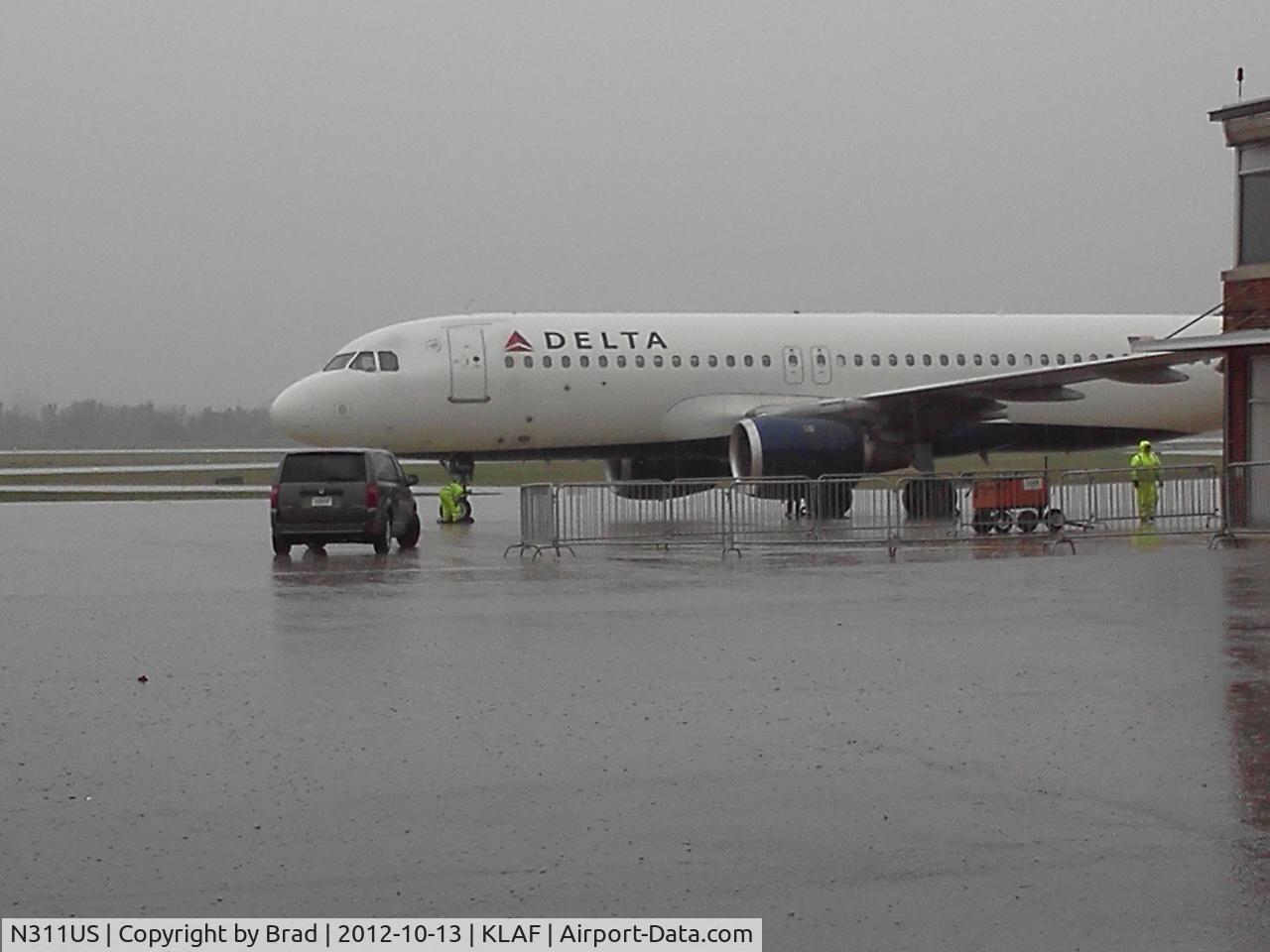 N311US, 1990 Airbus A320-211 C/N 125, after http://flightaware.com/live/flight/DAL8931/history/20121013/1737Z/KMSP/KLAF waiting to take University of Wisconsin football team back to Madison.