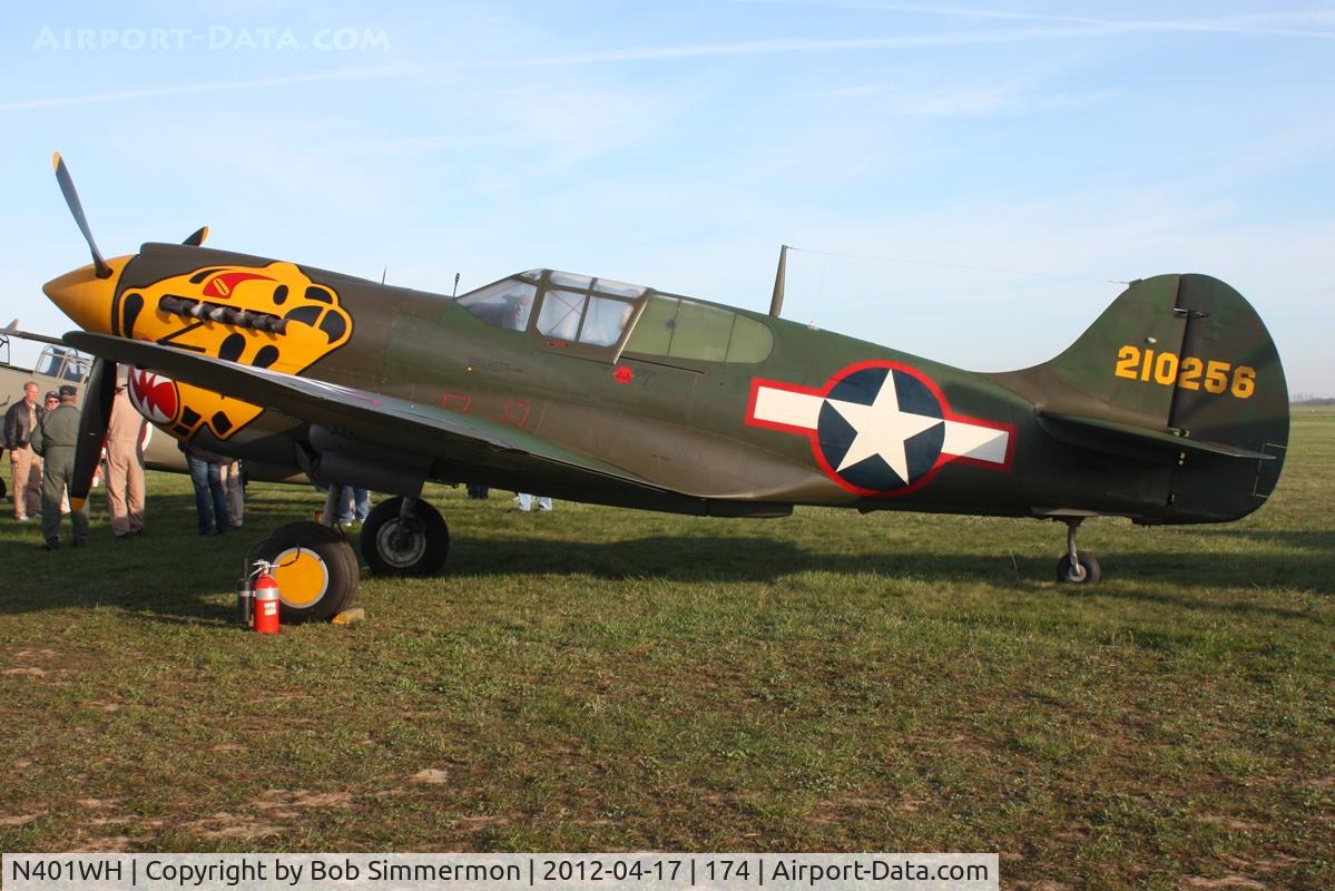 N401WH, 1942 Curtiss P-40K Warhawk C/N 42-10256, Dawn in the grass at Urbana, Ohio.