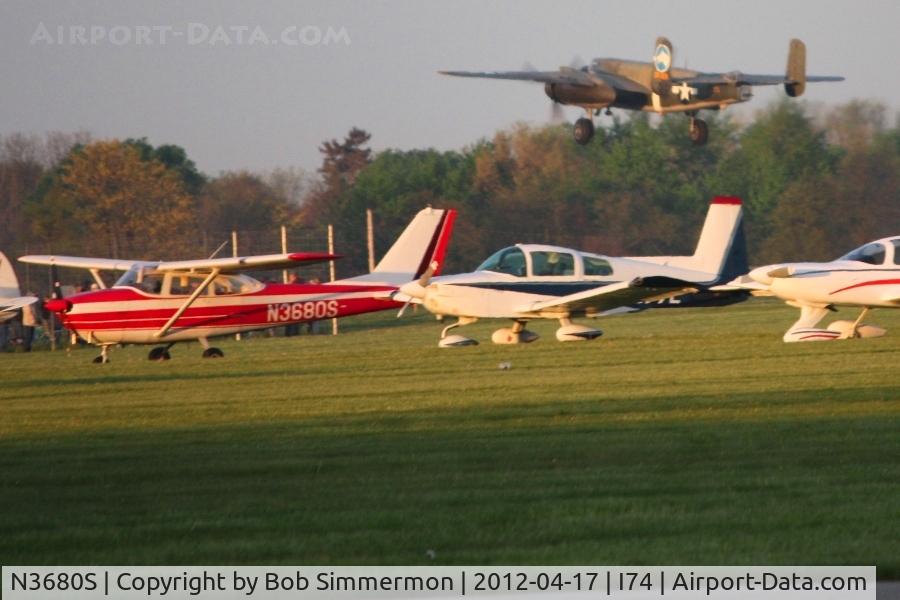 N3680S, 1963 Cessna 172E C/N 17250880, In the grass at Urbana during the B-25 Gathering.  B-25 N3476G departing in the background.