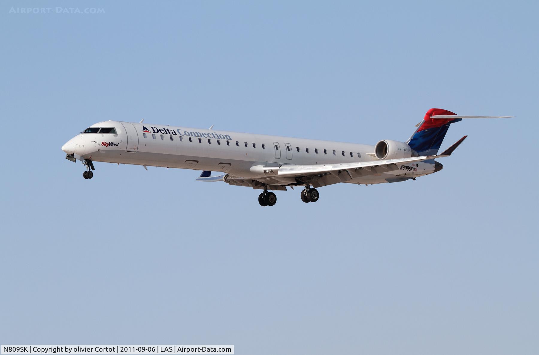 N809SK, 2006 Bombardier CRJ-900ER (CL-600-2D24) C/N 15086, landing at Vegas