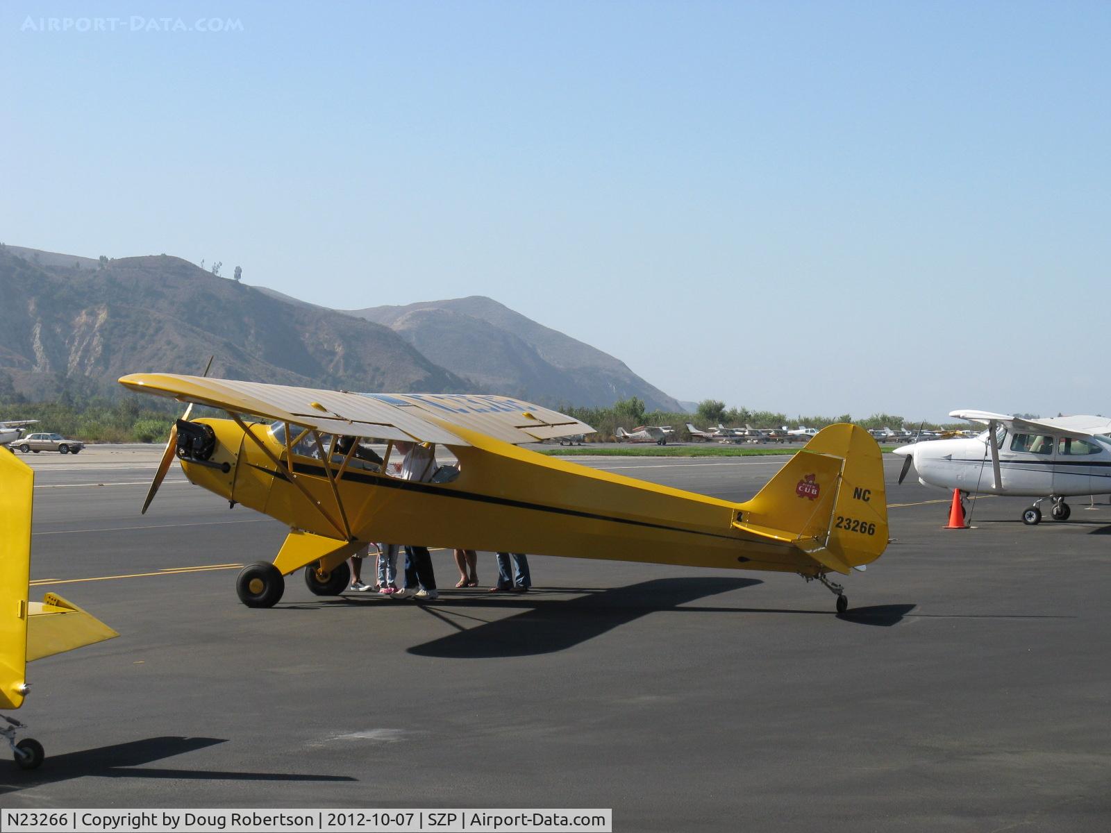 N23266, 1939 Piper J3C-65 Cub Cub C/N 3113, 1939 Piper J3C-65 CUB, Continental A&C65 65 Hp, Young Eagles flight interested parents and friends at the airplane where the YE aircraft are loaded and they witness the pre-flight explanations.