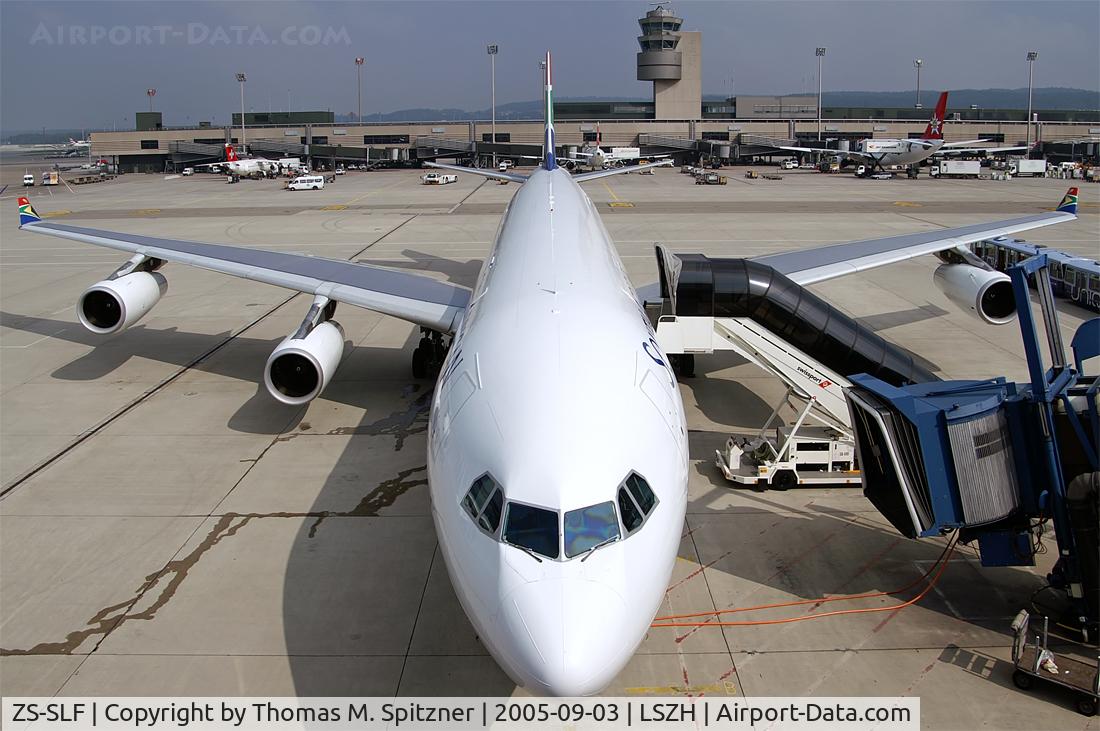 ZS-SLF, 1992 Airbus A340-211 C/N 006, SAA ( South African Airways ) ZS-SLF sitting at Dock B awaiting it's next service. Wide angle lens shot