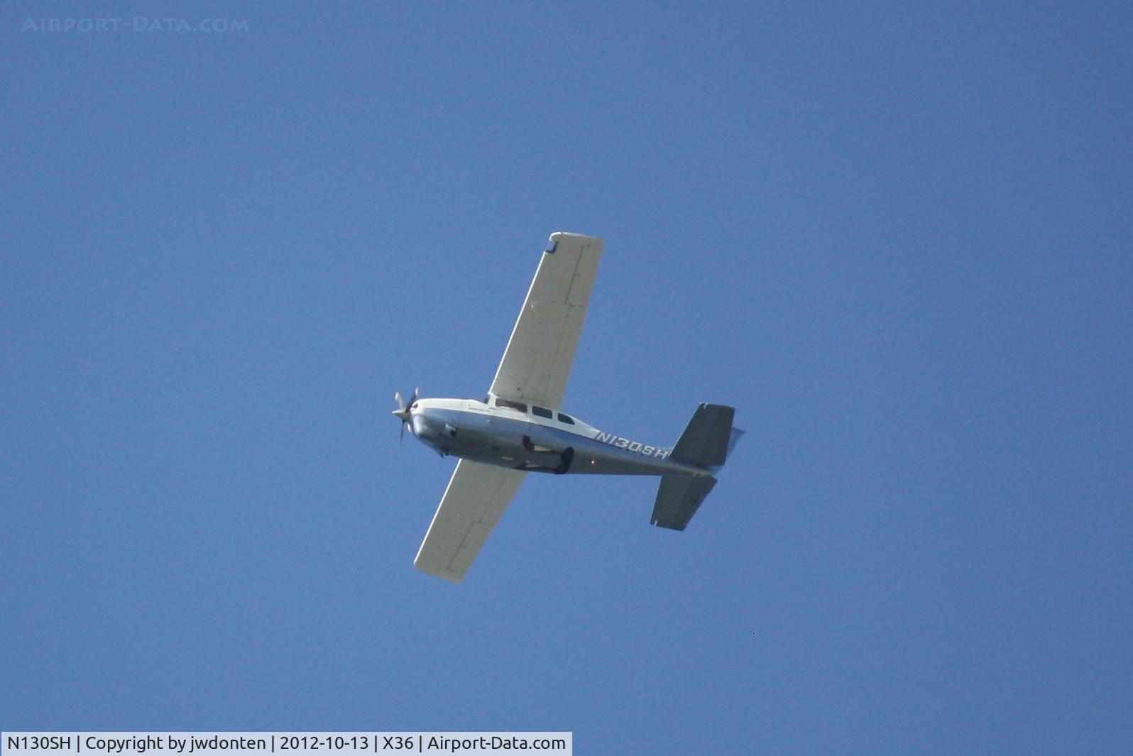 N130SH, 1968 Cessna 210H Centurion C/N 21059060, Cessna Centurion (N130SH) flies over Buchan Airport
