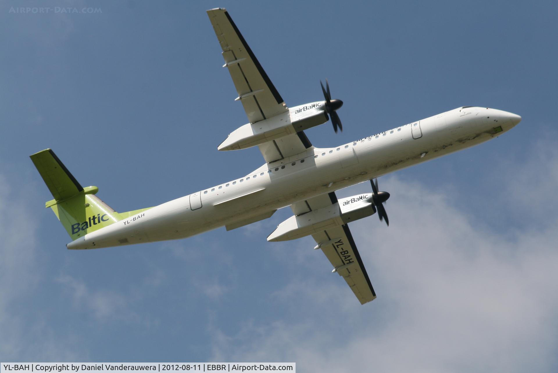 YL-BAH, 2010 De Havilland Canada DHC-8-402Q Dash 8 C/N 4296, Flight BT602 is climbing from RWY 07R
